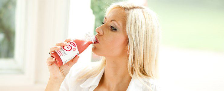 Woman drinking Innocent Smoothie