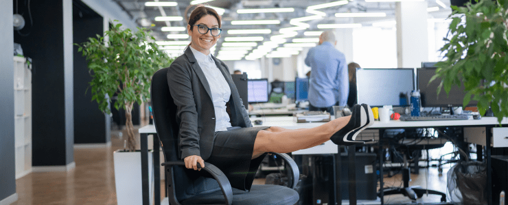 Female office worker doing chair Pilates