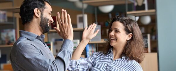 Colleagues high-fiving